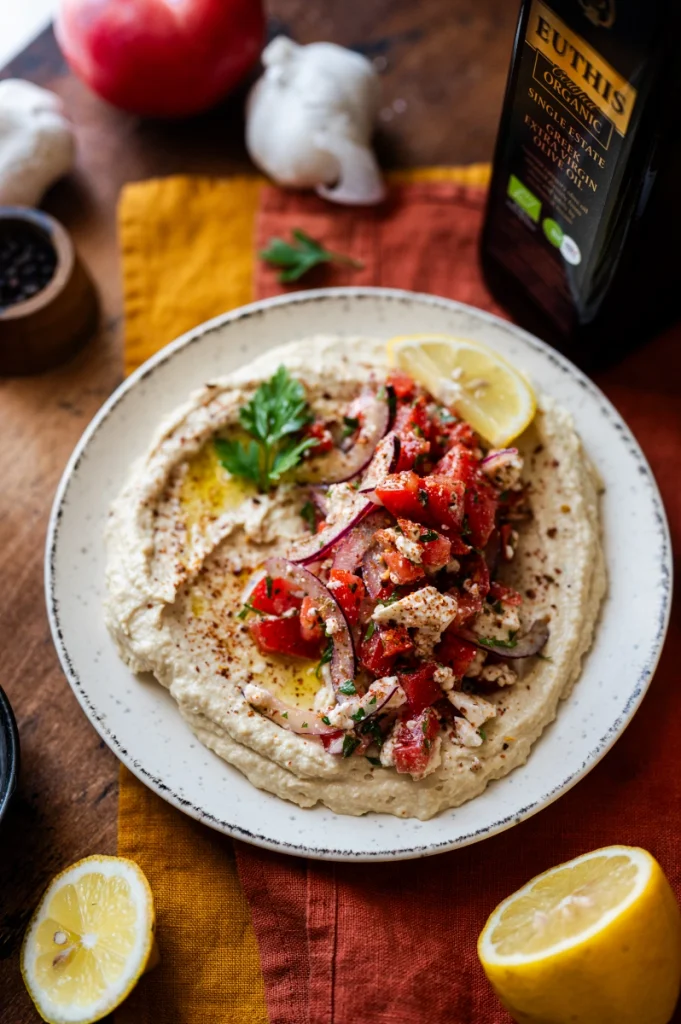 Loaded hummus with feta, tomato, red onion, oregano and Euthis extra virgin olive oil