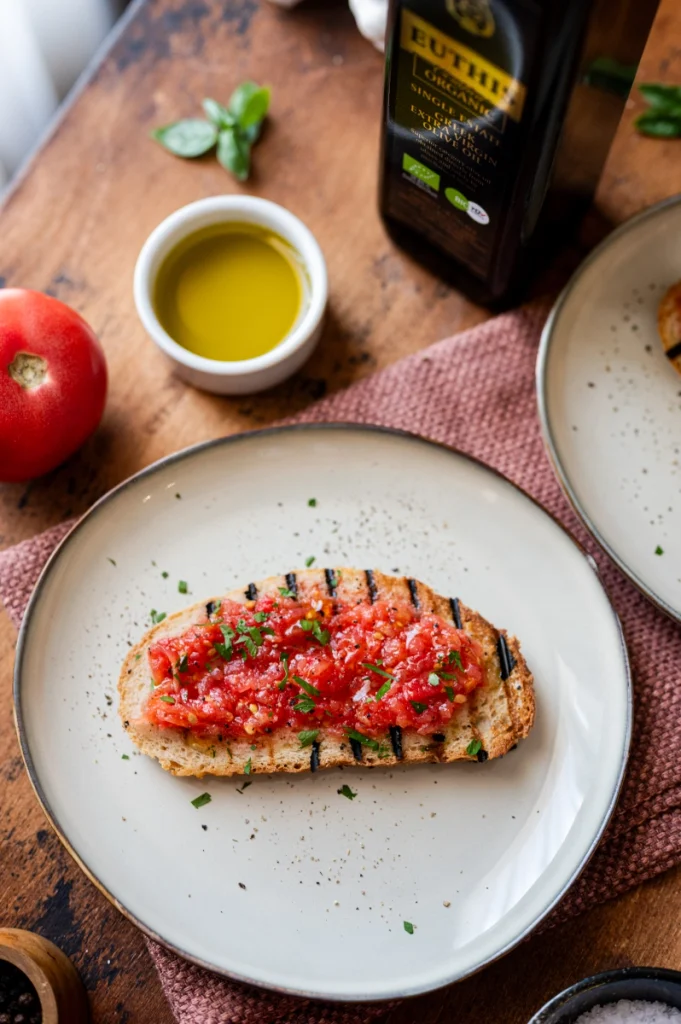 Pan con Tomate with grated ripe tomato, toasted bread and Euthis extra virgin olive oil